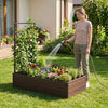 Rattan raised garden bed with trellis, ideal for flowers and vegetables, placed in a sunny backyard setting.