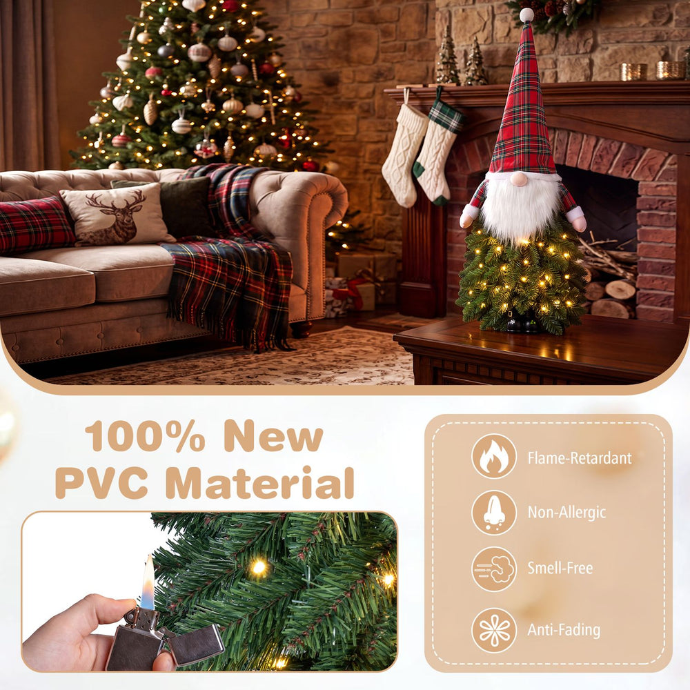 3 ft pre-lit mini tabletop Christmas tree in green and red features 20 LED lights and a Santa-inspired design for festive decor.