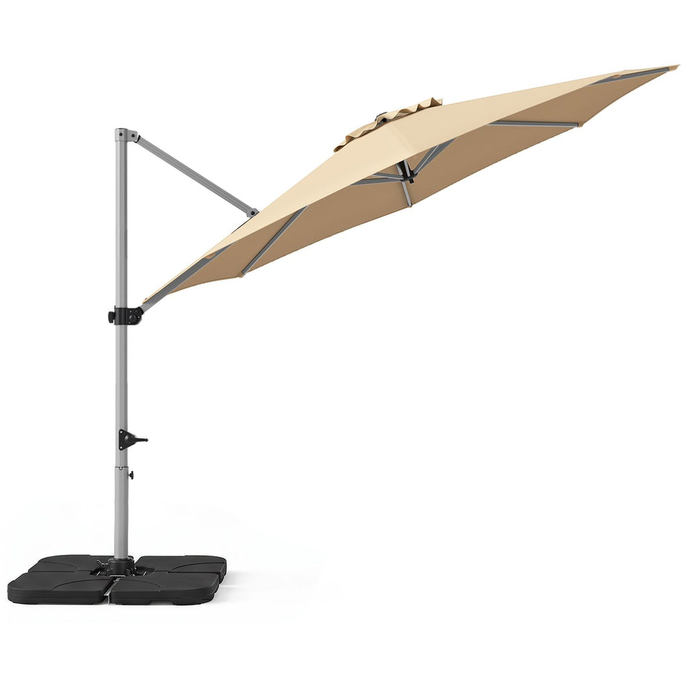 Beige 11 ft cantilever patio umbrella shown in side view with its heavy-duty 4-piece base for outdoor shade.