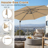 Beige 11 ft cantilever patio umbrella with heavy-duty 4-piece base shown open above an outdoor seating area.