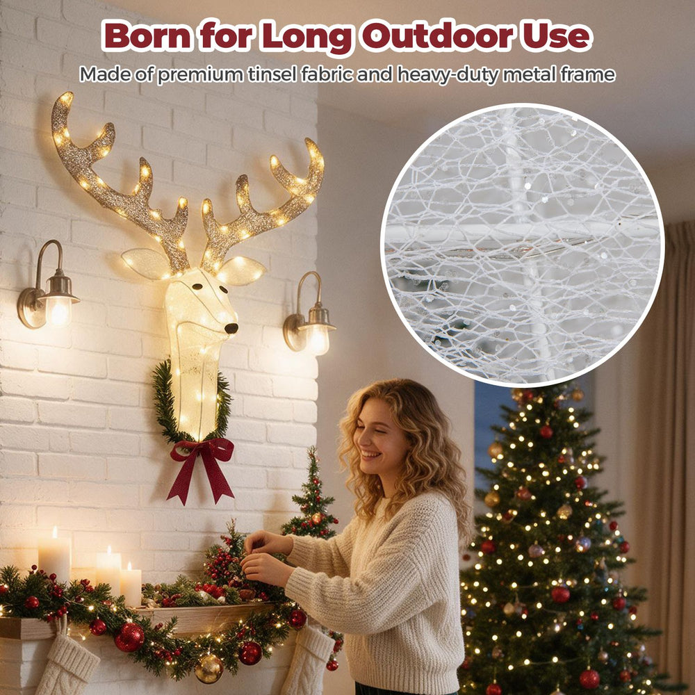 Pre-lit 3D Rudolph hanging wreath with LED warm white lights, shown on a Christmas wall beside holiday decor.