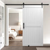 VEVOR sliding barn door installed in a room setting, white door with black track hardware