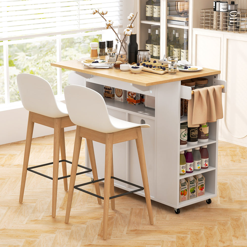 Rolling kitchen island cart in white and natural wood, featuring ample storage, power outlets, and a space-saving drop.