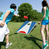 Portable 3 x 2FT cornhole board set in blue with foldable legs, featuring players tossing bean bags outdoors.