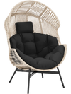 Wicker oversized egg style chair with black cushions and headrest, featuring a light brown rattan design for versatile.