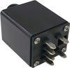 A close-up of the Journey Zoomer Power Chair Charging Adapter, a black rectangular accessory with four metal prongs and visible screws on the front.